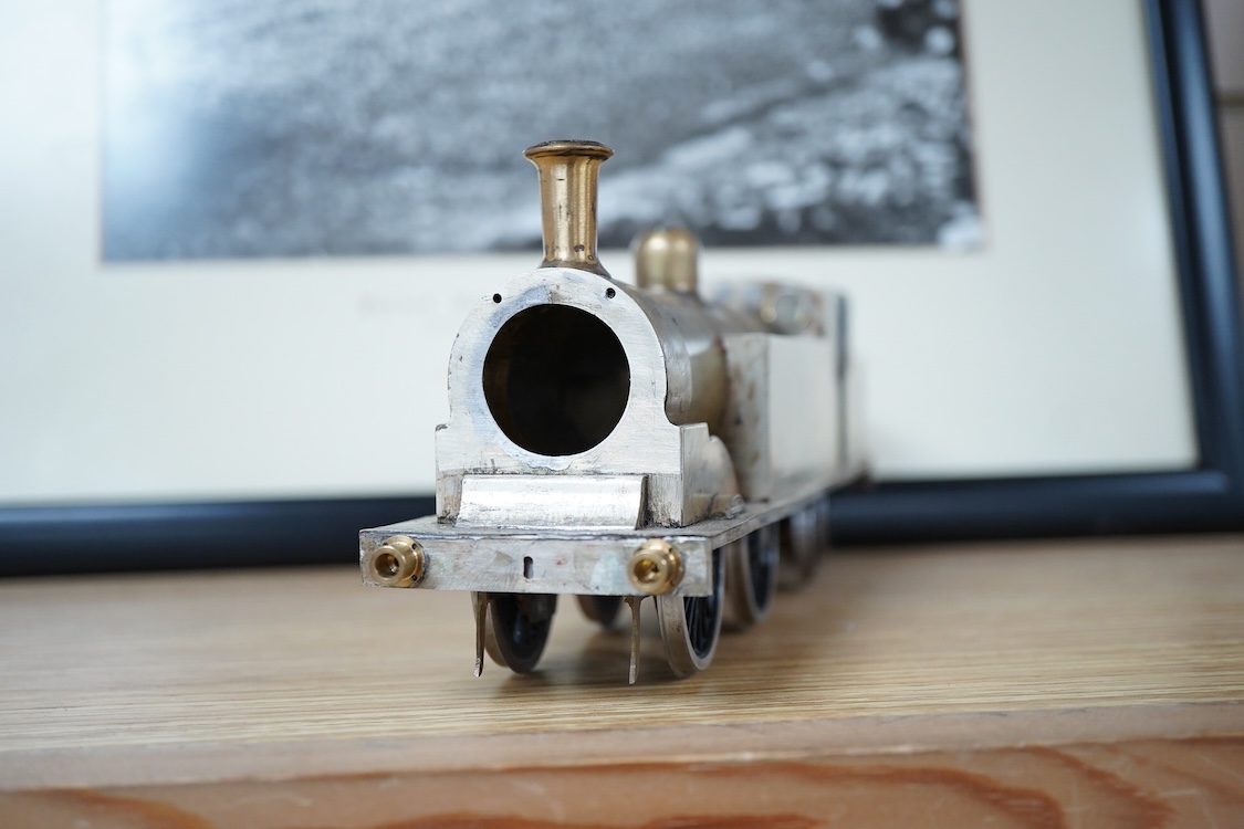 Eleven 0 gauge model railway items including; a bogie stake wagon, two mineral wagons, a North British coal wagon and two further open wagons, a partly constructed brake van, together with a Lima LMS 4F locomotive, two L